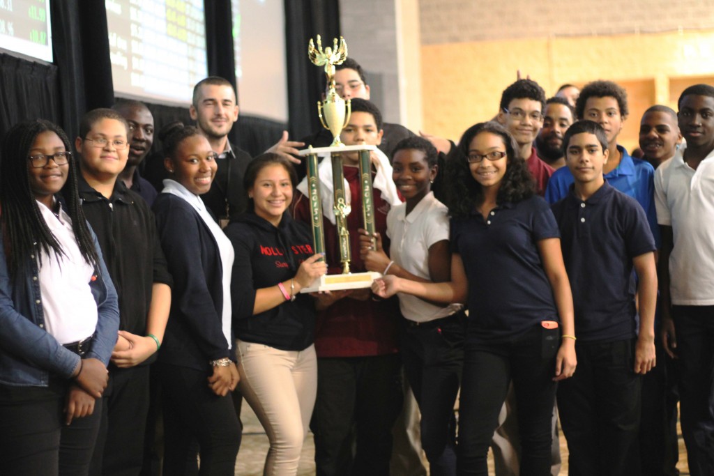 Winning student team holding trophy