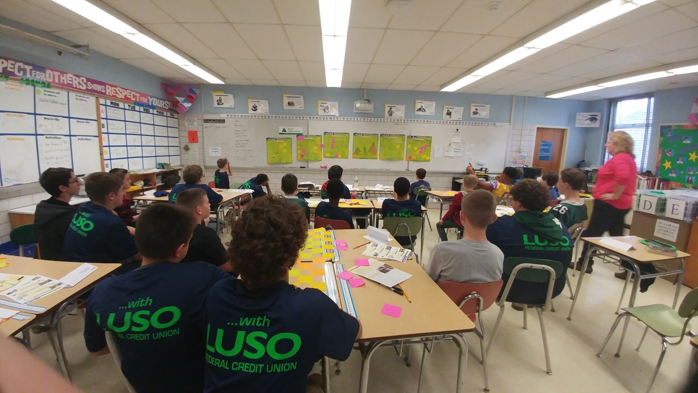 Classroom with students wearing Luso Credit union shirts