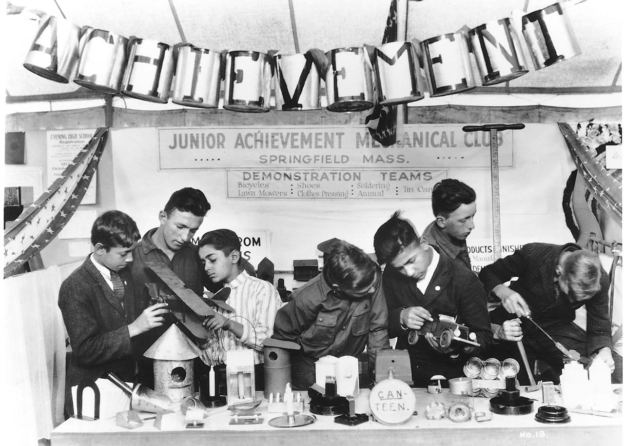 Historical photo of JA mechanical club working on a CAN-TEEN project