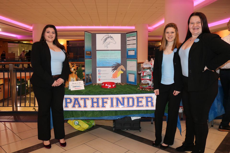 Pathfinder student team members in front of their business