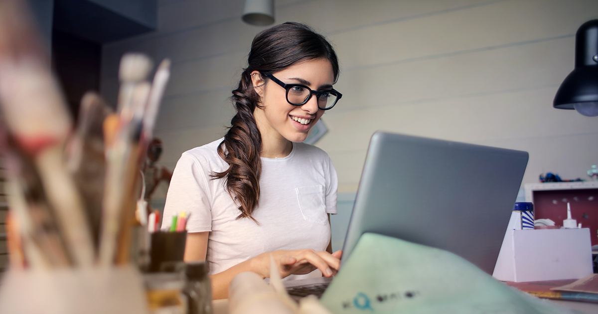 woman in glasses on computer