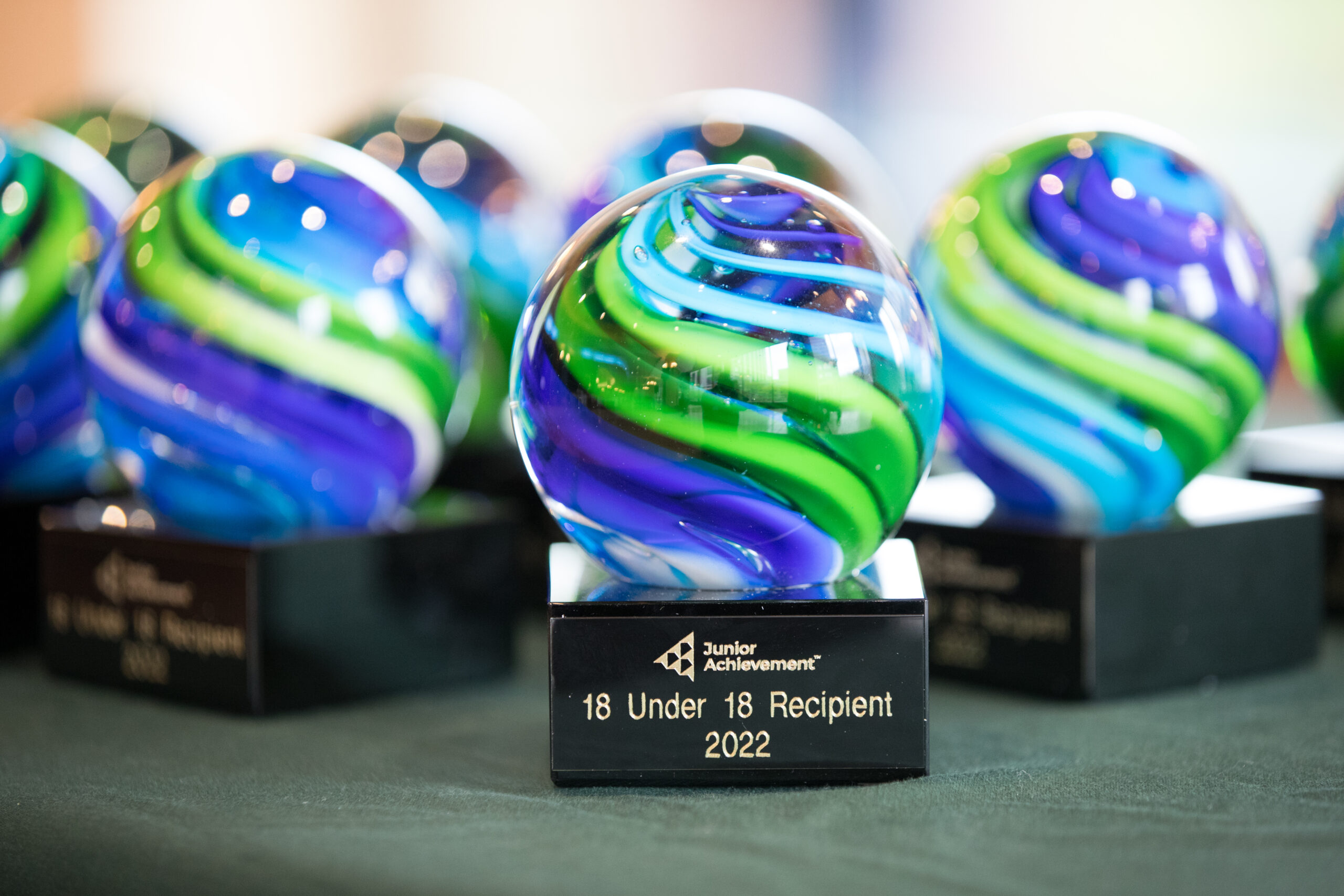 glass awards displayed on table